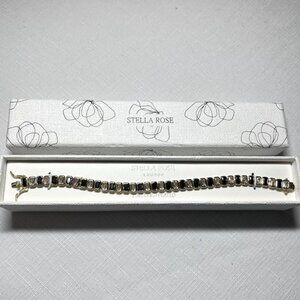 New STELLA ROSE black  clear crystal tennis bracelet Strong clasp Gold plated